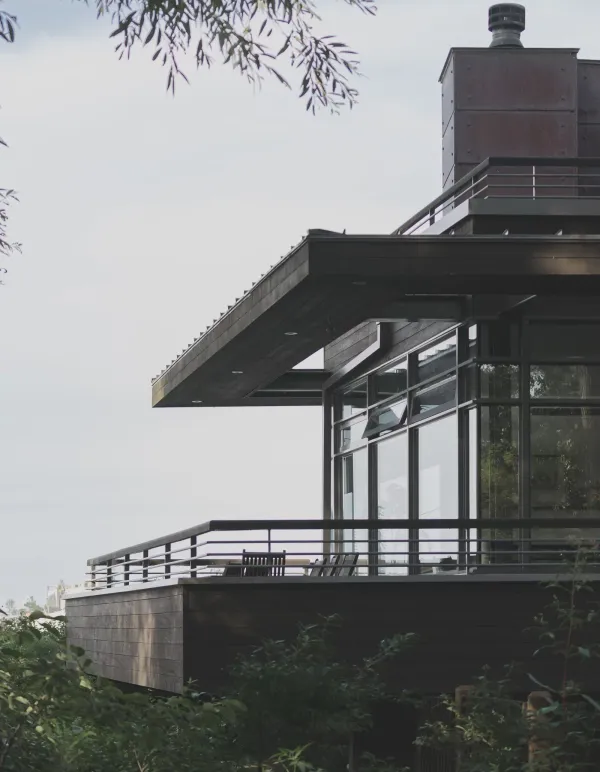 A contemporary house cantilevered over bushland