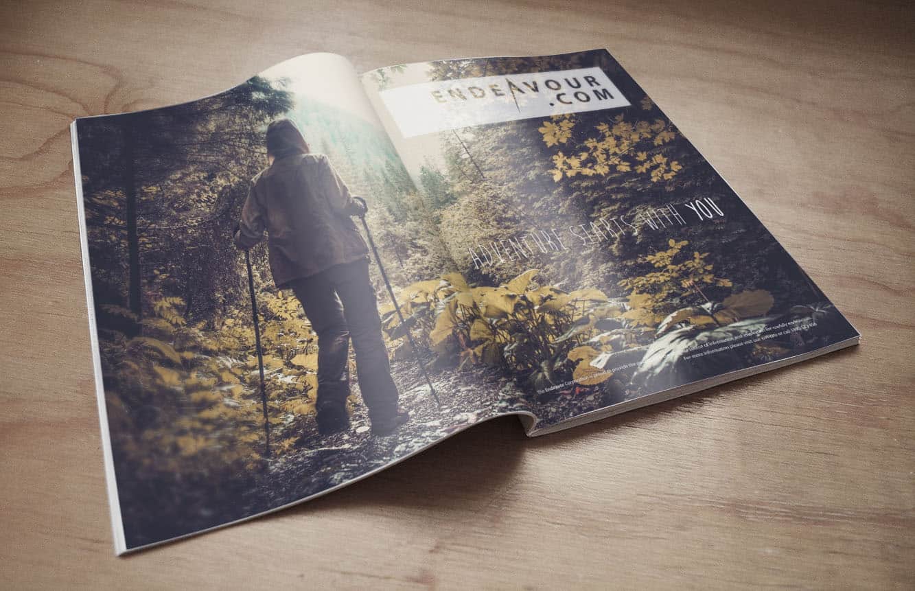 Second Endeavour magazine design created by The Tasmanian Web Company. Hiker on a trail in the forest in darker colours, consistent with the nature-based aesthetic of the brand, developed by leading web designers Devonport. 