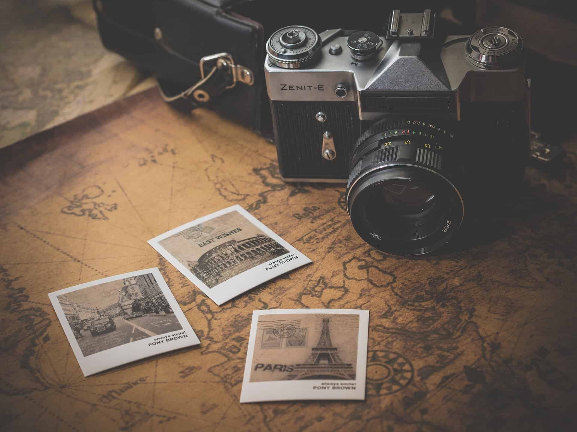 Vintage aesthetic camera and polaroid photos showing that brand design helps to create a connection between businesses and their audience.